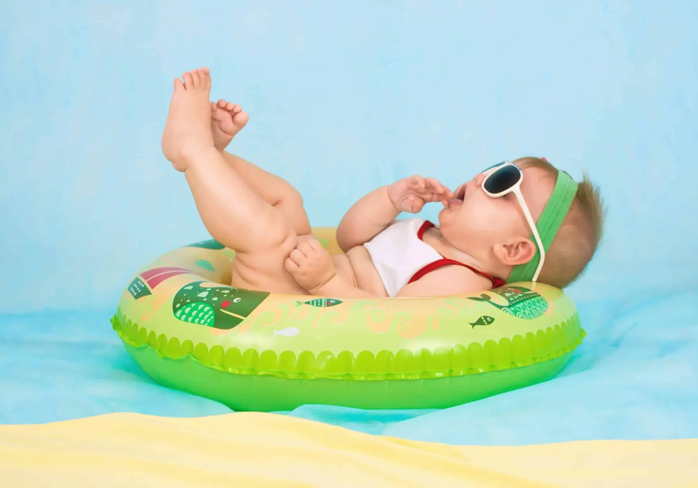 baby lying on inflatable ring